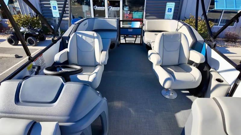 Slide: The Image of 2025 Sylvan A-Series A20 LZ DH boat interior with plush seating and modern design. - 9