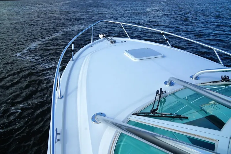 Slide: The Image of 2009 Contender 38 Express boat on open water, view from bow. - 11