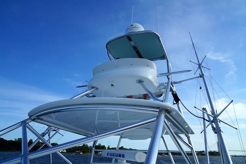 Slide: The Image of 2009 Contender 38 Express boat tower against a clear blue sky. - 13