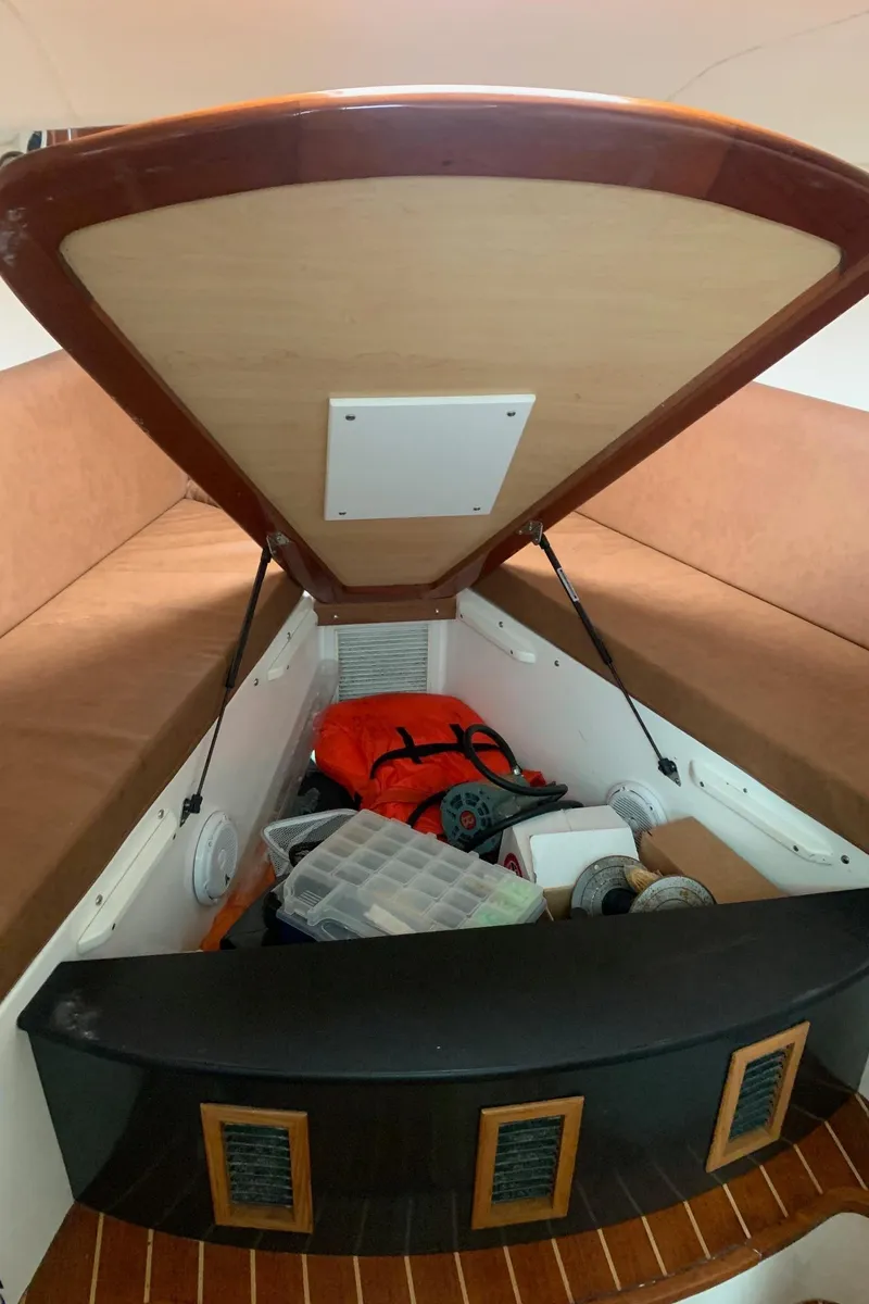 Slide: The Image of 2009 Contender 38 Express cabin storage with safety gear and equipment. - 19