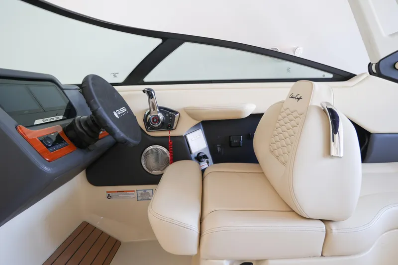 Slide: The Image of Interior of 2026 Chris-Craft Sportster 28, featuring luxurious beige seating and modern controls. - 6
