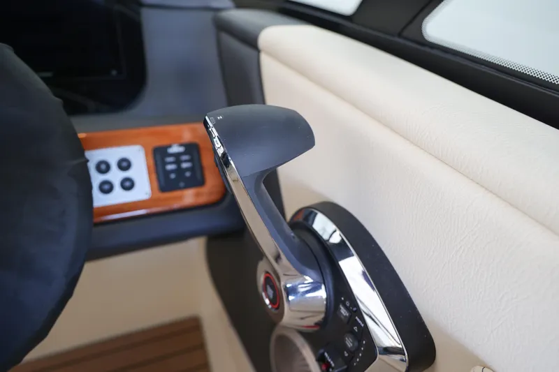 Slide: The Image of Close-up of 2026 Chris-Craft Sportster 28 throttle control in a luxurious interior. - 8