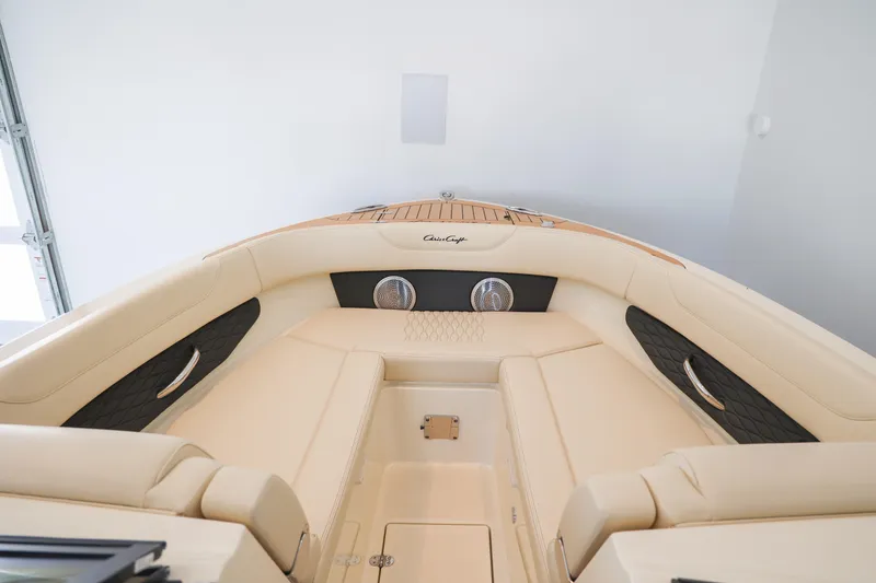 Slide: The Image of Luxurious interior of 2026 Chris-Craft Sportster 28 boat with beige seating and sleek design. - 9