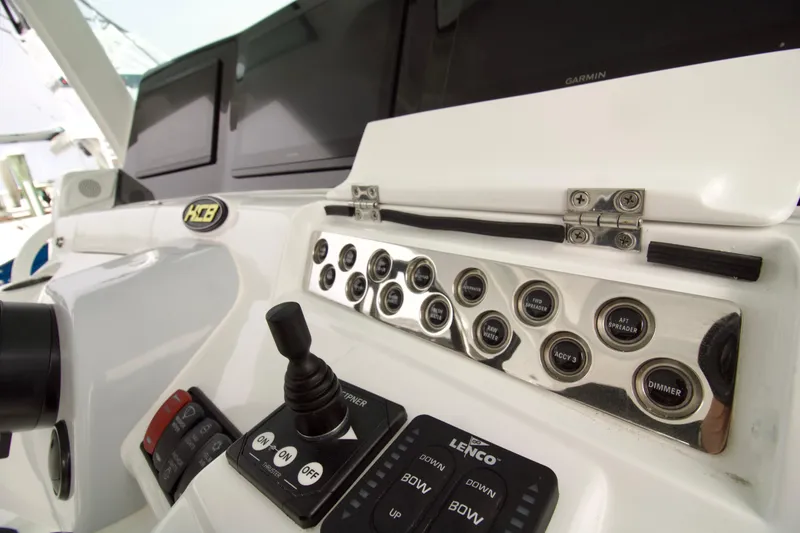 Slide: The Image of Control panel of 2026 HCB 42 Lujo boat with switches and joystick. - 13