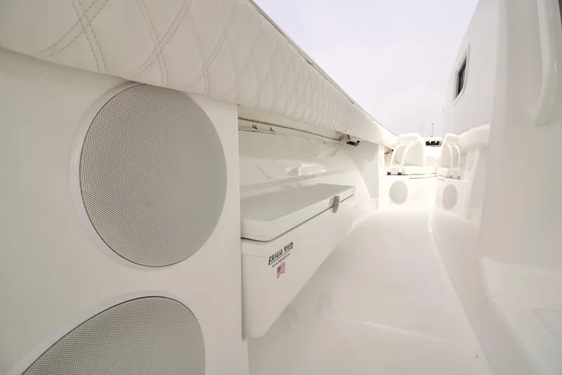 Slide: The Image of Interior view of 2026 HCB 42 Lujo boat, featuring speakers and storage compartments. - 15