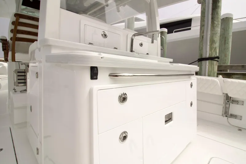 Slide: The Image of 2026 HCB 42 Lujo boat interior with sleek white cabinetry and modern design. - 22