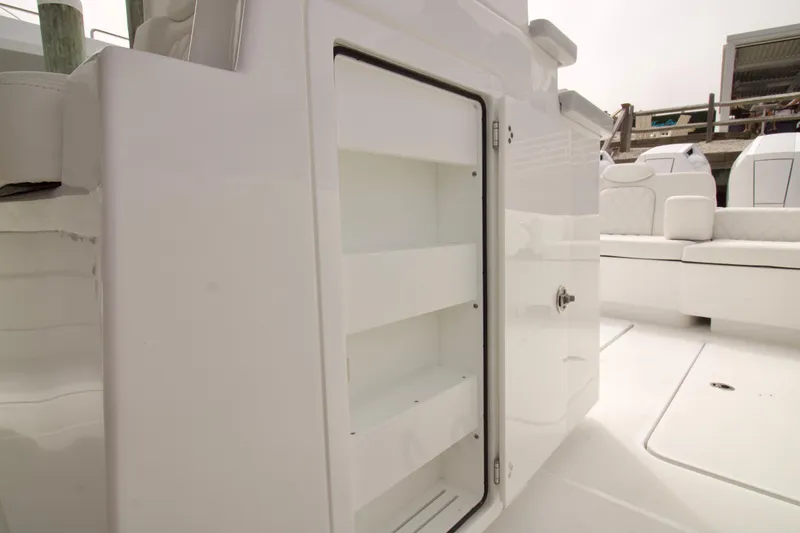 Slide: The Image of Open storage compartment on 2026 HCB 42 Lujo boat, showcasing sleek interior design. - 23