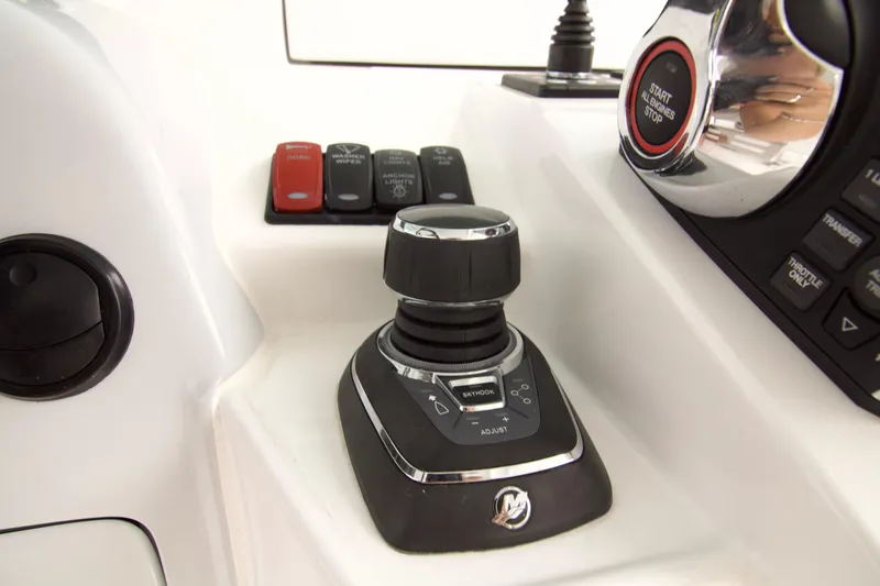 Slide: The Image of Control panel of 2026 HCB 42 Lujo boat with joystick and buttons. - 26