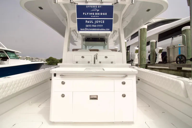 Slide: The Image of 2026 HCB 42 Lujo boat interior with sleek white cabinetry and modern design. - 33