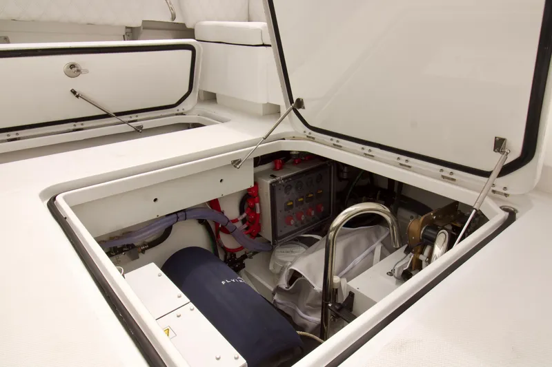 Slide: The Image of 2026 HCB 42 Lujo boat interior showing open storage compartments and mechanical equipment. - 34