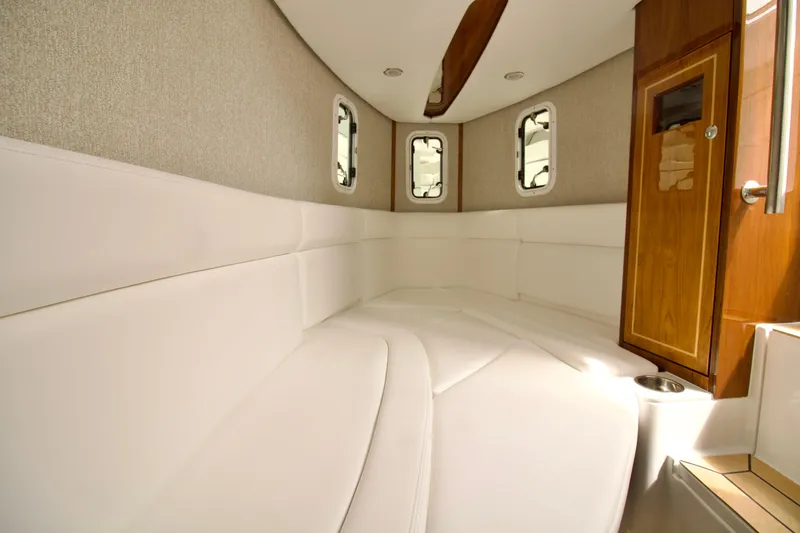 Slide: The Image of Luxurious interior of 2026 HCB 42 Lujo boat with white seating and wooden accents. - 9