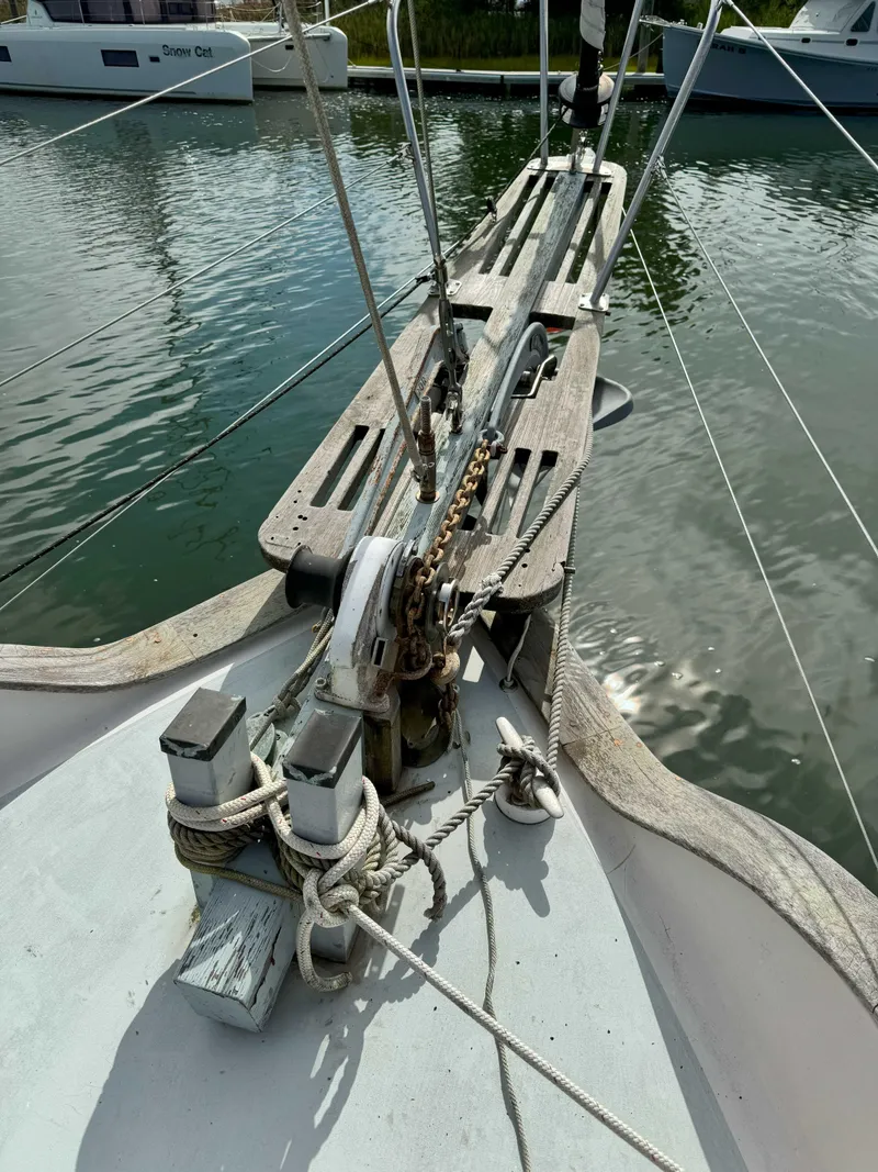 Slide: The Image of Bow of a 1975 Westsail 32 sailboat with rigging and anchor chain. - 14