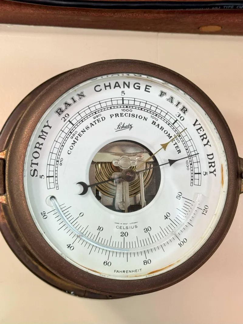 Slide: The Image of Vintage barometer on 1975 Westsail 32, indicating weather conditions from stormy to very dry. - 28
