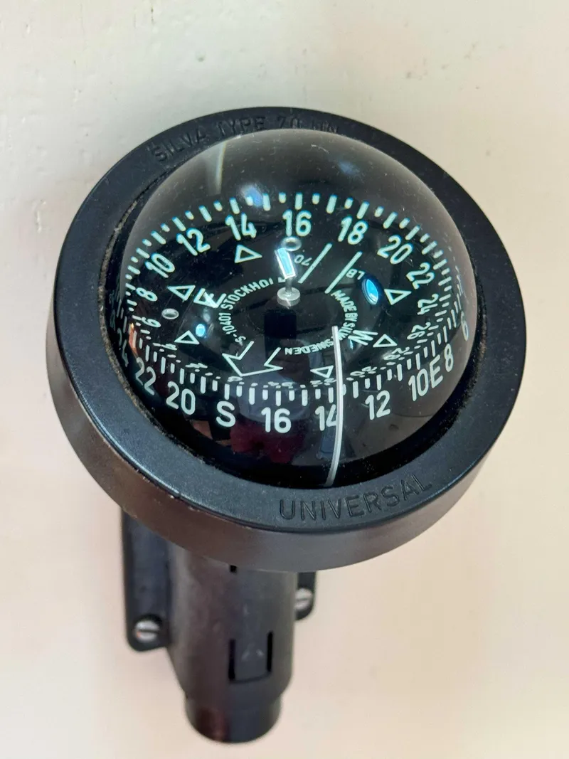Slide: The Image of Compass on 1975 Westsail 32 boat, displaying cardinal directions and degrees. - 29