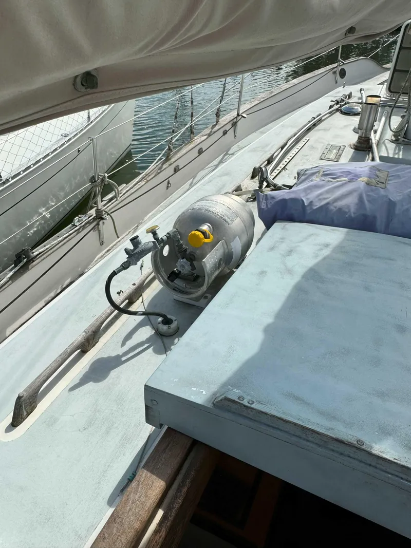 Slide: The Image of 1975 Westsail 32 sailboat deck with propane tank and equipment. - 30