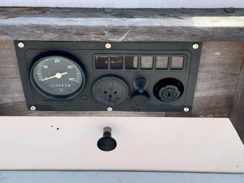 Slide: The Image of Control panel of a 1975 Westsail 32 sailboat with Yanmar gauge. - 33