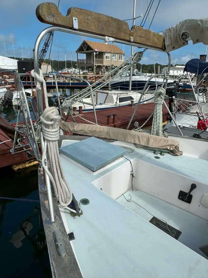 Slide: The Image of 1975 Westsail 32 sailboat docked at a marina, featuring rigging and deck details. - 7