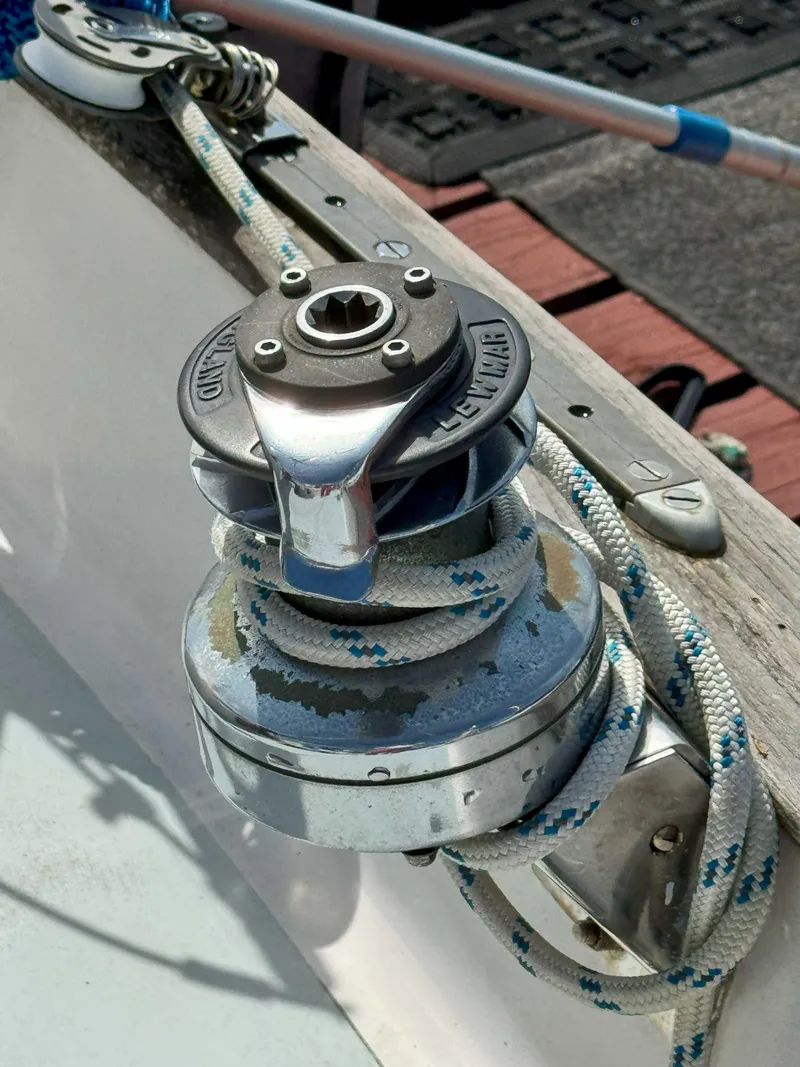 Slide: The Image of 1975 Westsail 32 sailboat winch with rope, showcasing marine hardware details. - 8