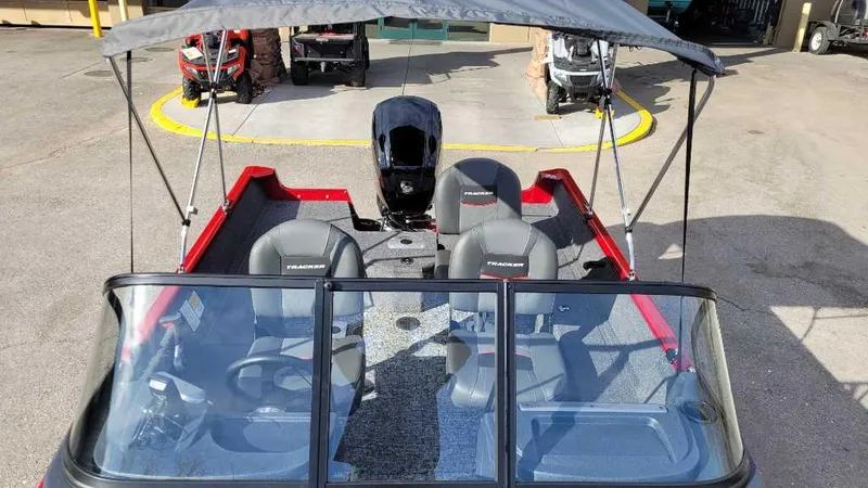 Slide: The Image of 2025 Tracker Pro Guide V-16 WT boat with canopy and seating, viewed from above. - 8