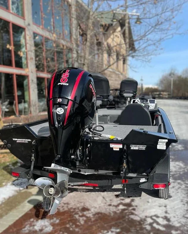 Slide: The Image of 2025 Tracker Pro Team 195 Tournament Edition boat with powerful outboard motor. - 4