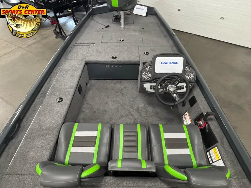 Slide: The Image of 2025 Ranger RT188C boat interior with Lowrance system, gray and green seating, and steering wheel. - 3