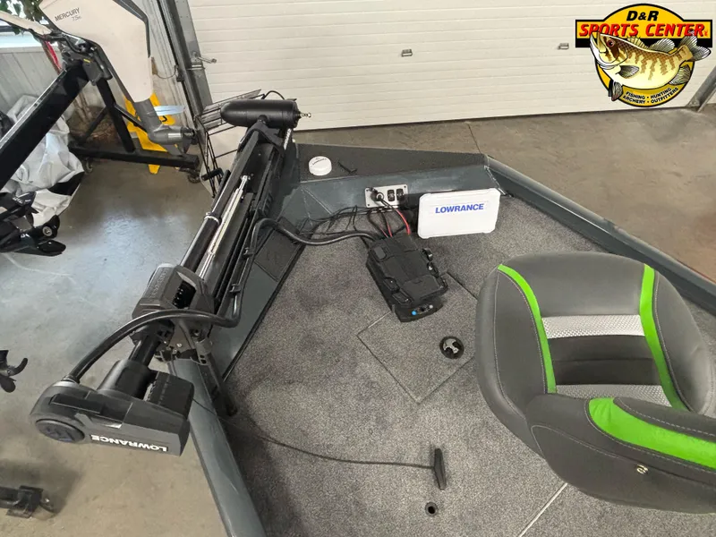 Slide: The Image of 2025 Ranger RT188C boat interior with Lowrance equipment and Mercury motor in a showroom. - 5