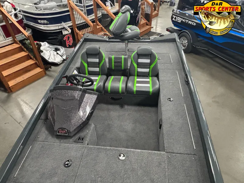 Slide: The Image of 2025 Ranger RT188C boat interior with green-accented seats at D&R Sports Center showroom. - 6