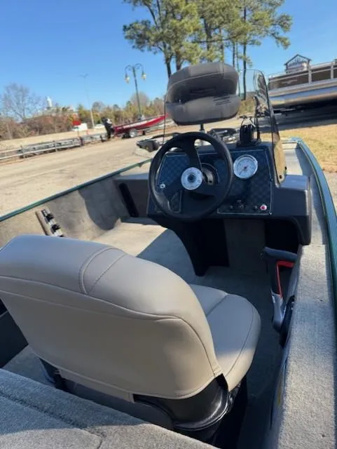 Slide: The Image of 2025 Tracker Bass Tracker Classic Limited boat interior with steering wheel and gauges. - 41