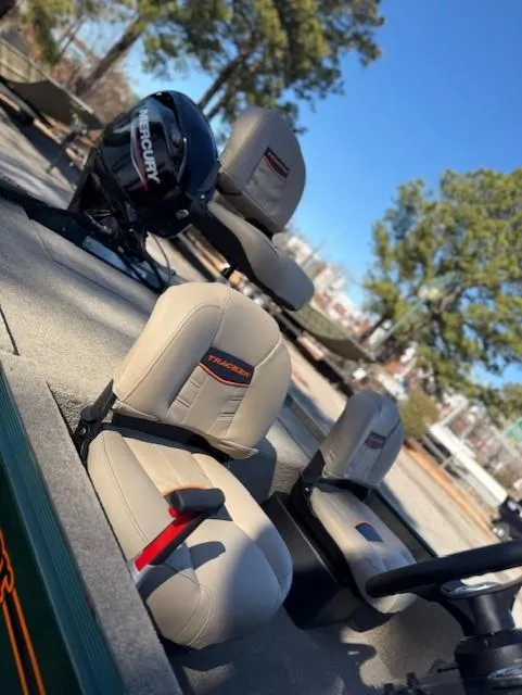 Slide: The Image of 2025 Tracker Bass Tracker Classic Limited boat with beige seats and Mercury engine. - 43
