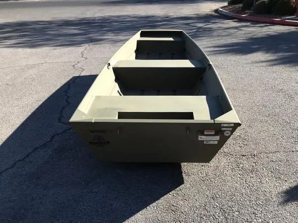 Slide: The Image of 2025 Tracker Grizzly 1436 Utility boat on pavement, showcasing its sturdy design. - 2