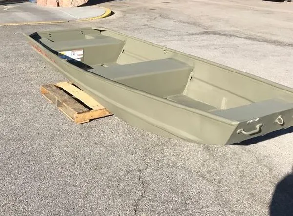 Slide: The Image of 2025 Tracker Grizzly 1436 Utility boat on a wooden pallet outdoors. - 4