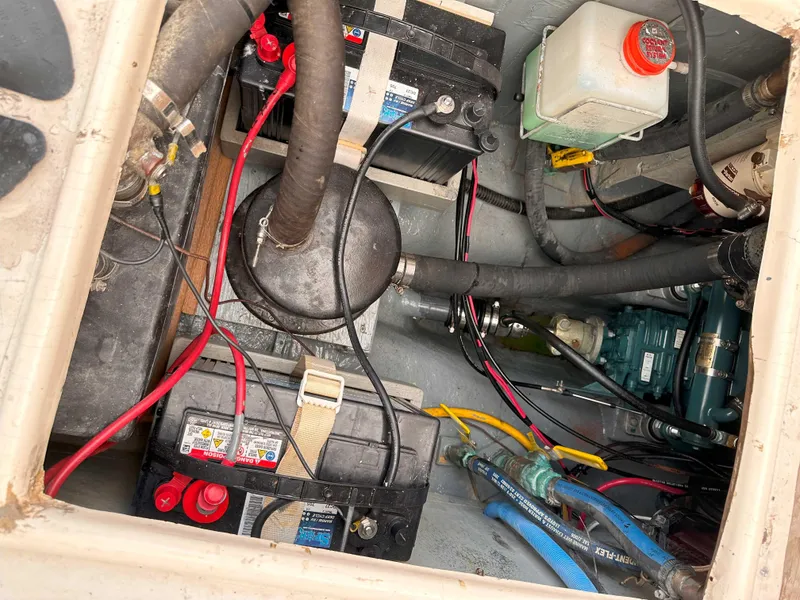 Slide: The Image of Engine compartment of a 1969 Contest 29 boat, showing batteries and wiring. - 16