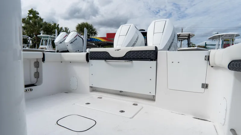 Slide: The Image of 2025 Tidewater 320 CC Adventure boat interior with dual outboard engines. - 12
