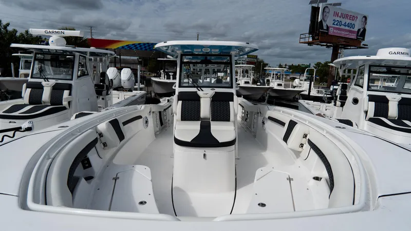 Slide: The Image of 2025 Tidewater 320 CC Adventure boat, sleek design, spacious seating, modern features. - 8