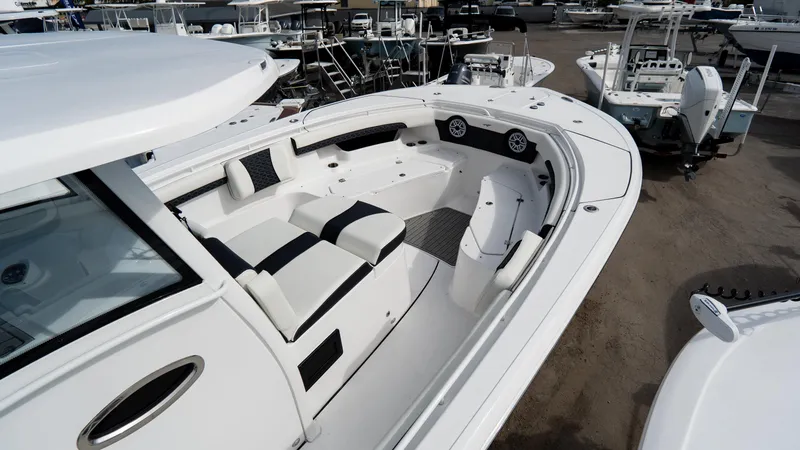 Slide: The Image of 2025 Tidewater 320 CC Adventure boat with spacious seating and modern design. - 9