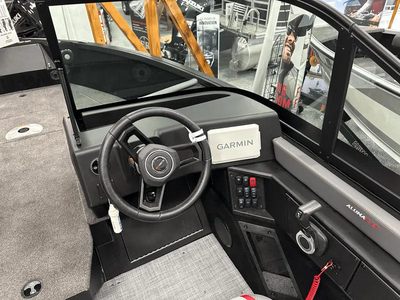 Slide: The Image of 2025 Alumacraft Trophy 185X Sport boat interior with advanced navigation equipment. - 10