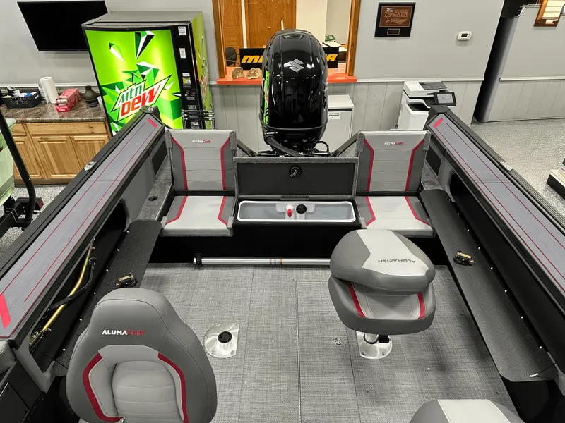 Slide: The Image of 2025 Alumacraft Trophy 185X Sport boat interior storage compartment open, showcasing spacious design. - 13