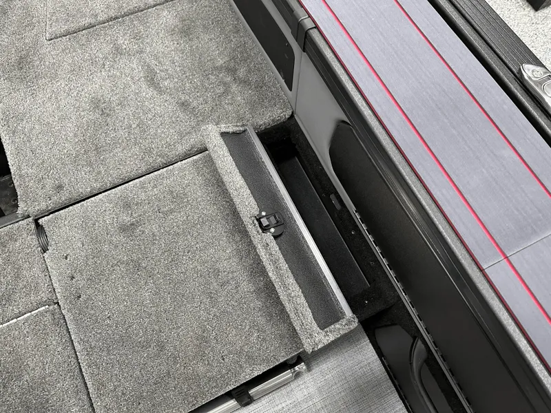 Slide: The Image of 2025 Alumacraft Trophy 185X Sport boat interior storage compartment. - 15