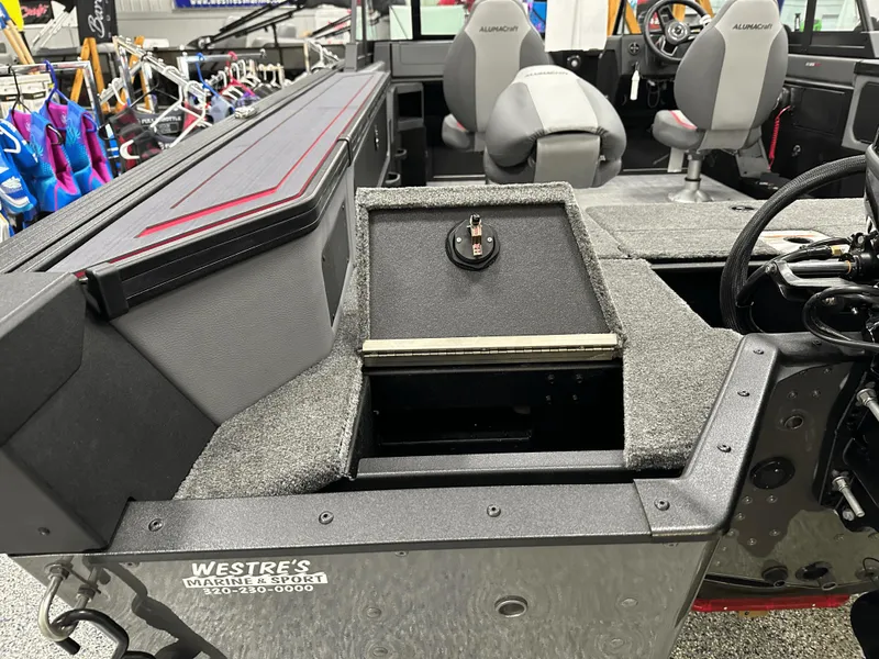 Slide: The Image of 2025 Alumacraft Trophy 185X Sport boat interior with navigation system and speakers. - 16