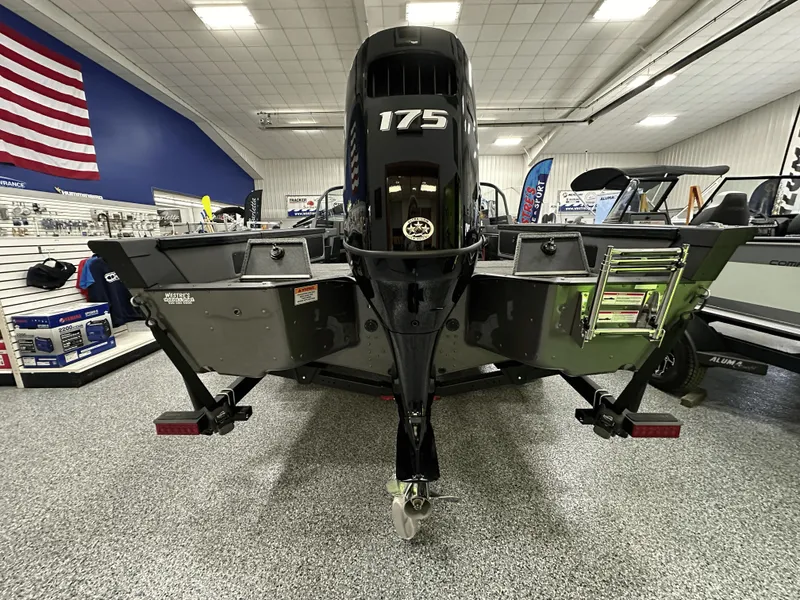 Slide: The Image of 2025 Alumacraft Trophy 185X Sport boat with Suzuki outboard motor on a trailer. - 2