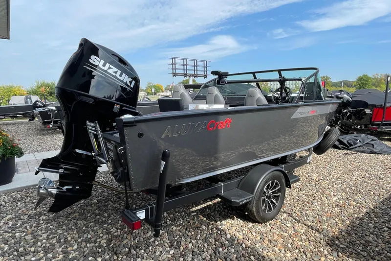 Slide: The Image of 2025 Alumacraft Trophy 185X Sport boat with Suzuki outboard motor in showroom. - 23