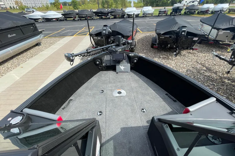 Slide: The Image of 2025 Alumacraft Trophy 185X Sport storage compartment with manuals and accessories. - 31