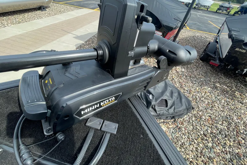 Slide: The Image of 2025 Alumacraft Trophy 185X Sport interior with storage compartment and seating. - 38