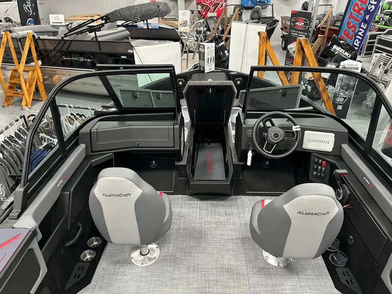 Slide: The Image of 2025 Alumacraft Trophy 185X Sport boat displayed at outdoor dealership. - 6