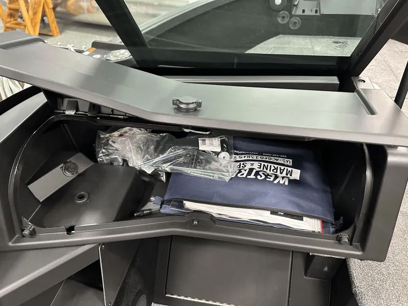 Slide: The Image of 2025 Alumacraft Trophy 185X Sport boat interior with Garmin navigation system. - 9