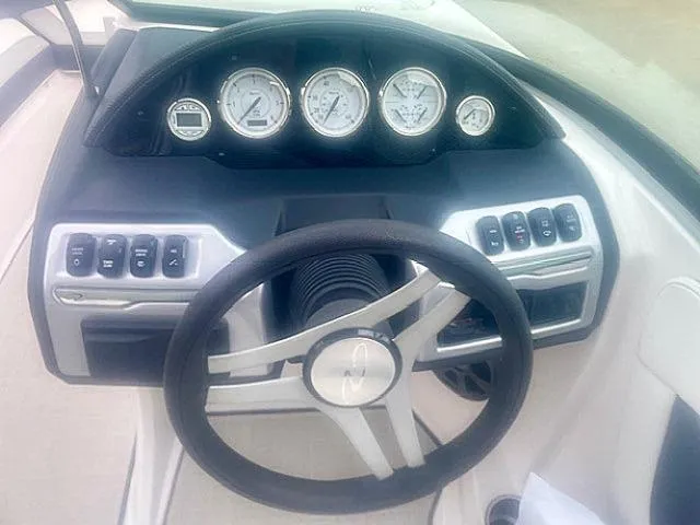 Slide: The Image of Dashboard of 2021 Regal 2000 ES Bowrider with steering wheel and gauges. - 10