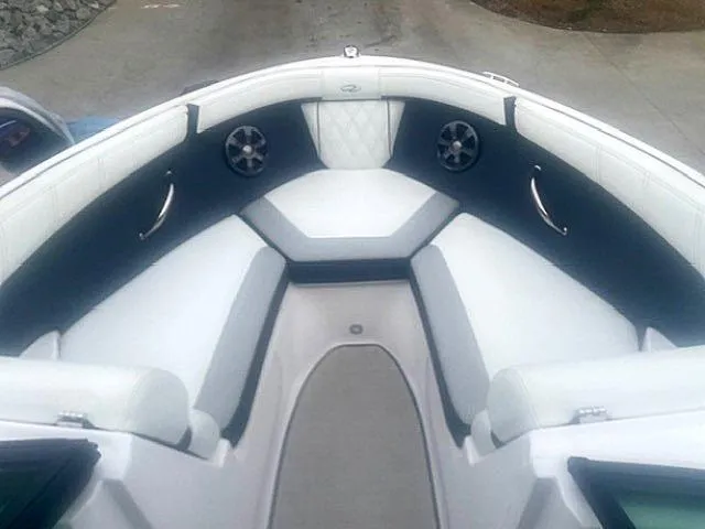 Slide: The Image of 2021 Regal 2000 ES Bowrider interior with white seating and speakers. - 11