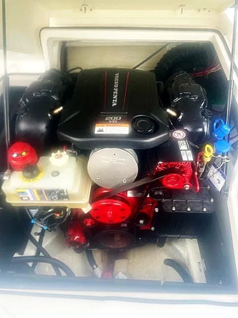 Slide: The Image of 2021 Regal 2000 ES Bowrider engine compartment with visible components and wiring. - 12