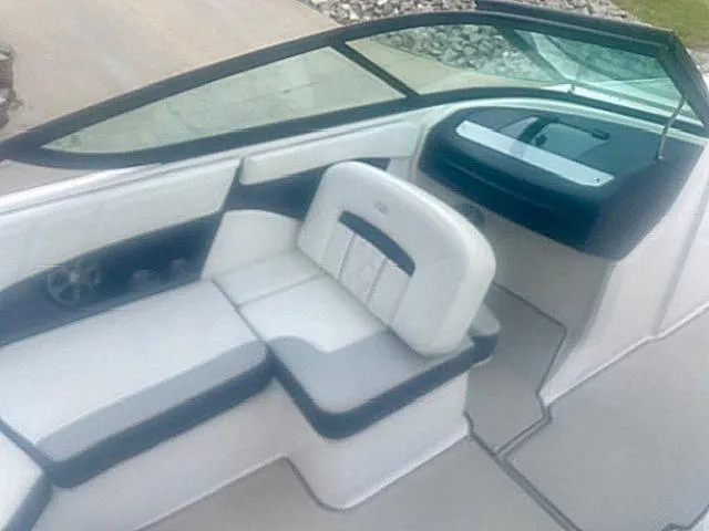 Slide: The Image of 2021 Regal 2000 ES Bowrider interior with white and gray seating, modern design. - 8