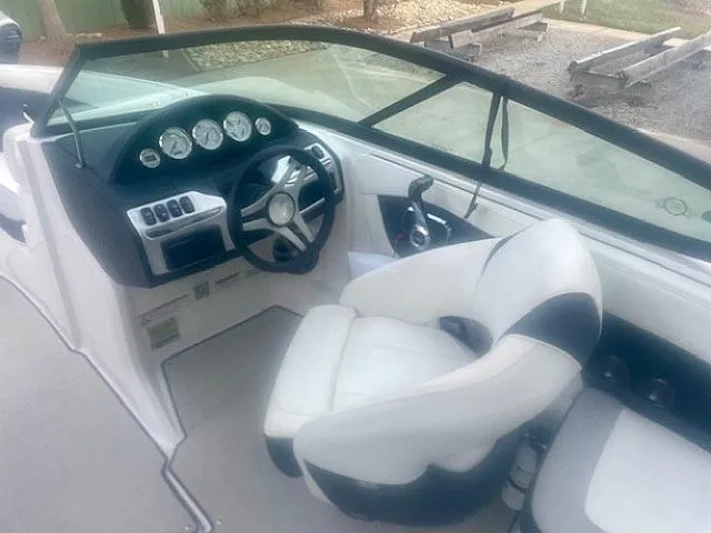 Slide: The Image of 2021 Regal 2000 ES Bowrider interior with steering wheel and dashboard controls. - 9